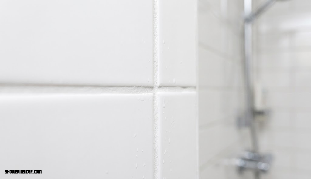 Close up of clean white grout lines between shower tiles